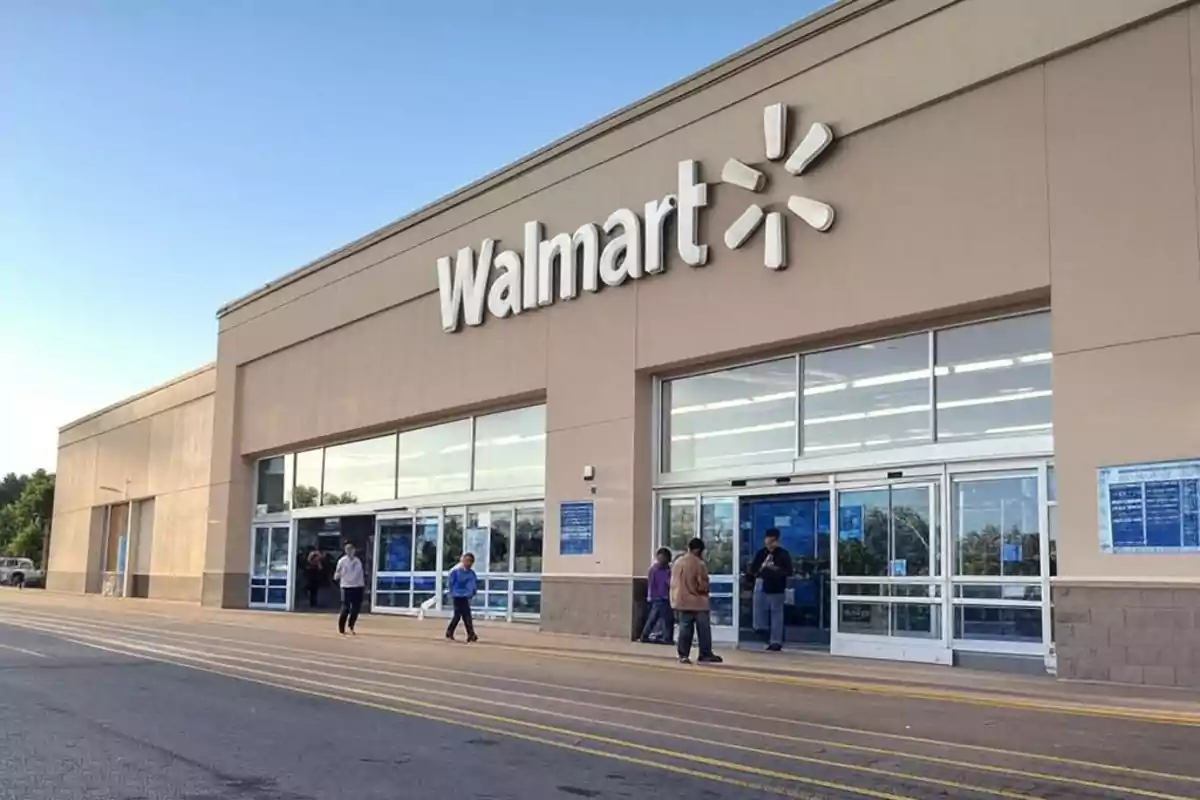 Walmart store facade with people entering and exiting. Walmart store facade with people entering and exiting.