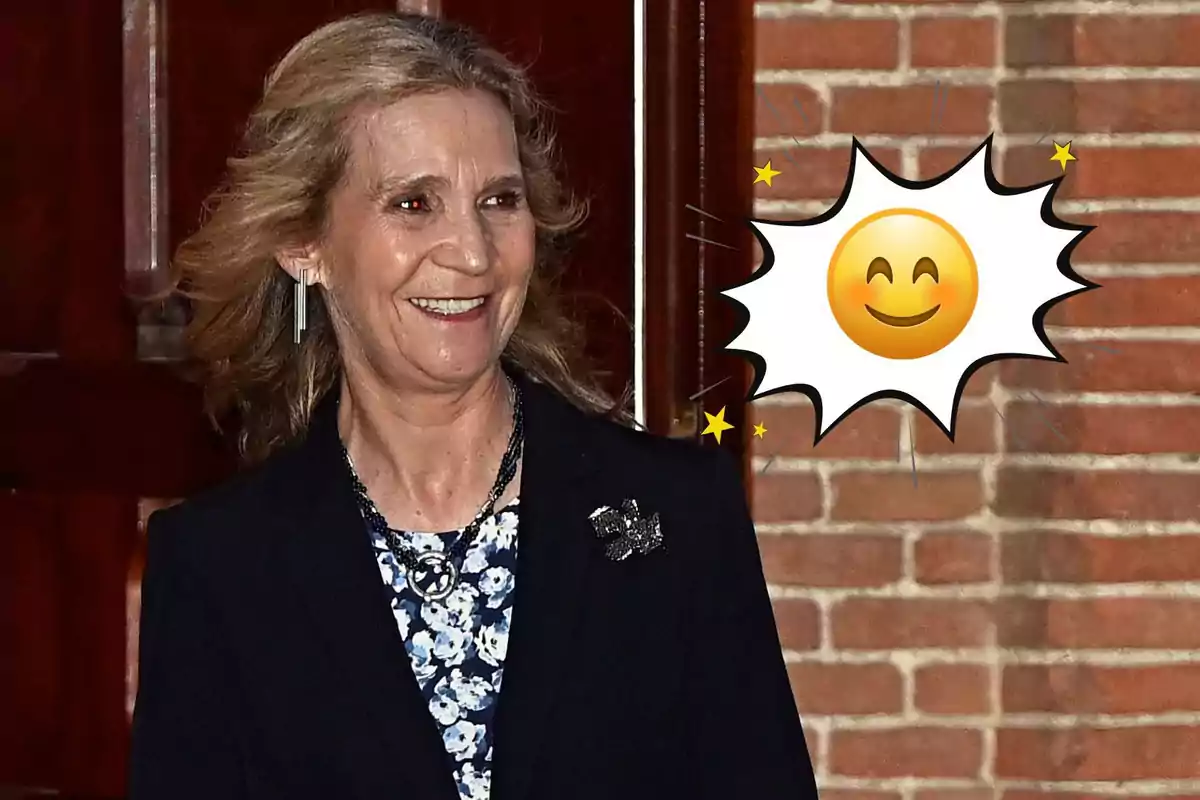 Dona de cabell ros somrient amb un emoji de careta feliç sobre un fons de maons