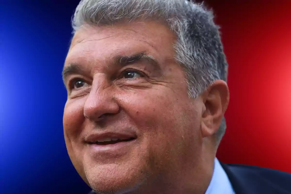 Gray-haired man smiling with a blue to red gradient background. Gray-haired man smiling with a blue to red gradient background.