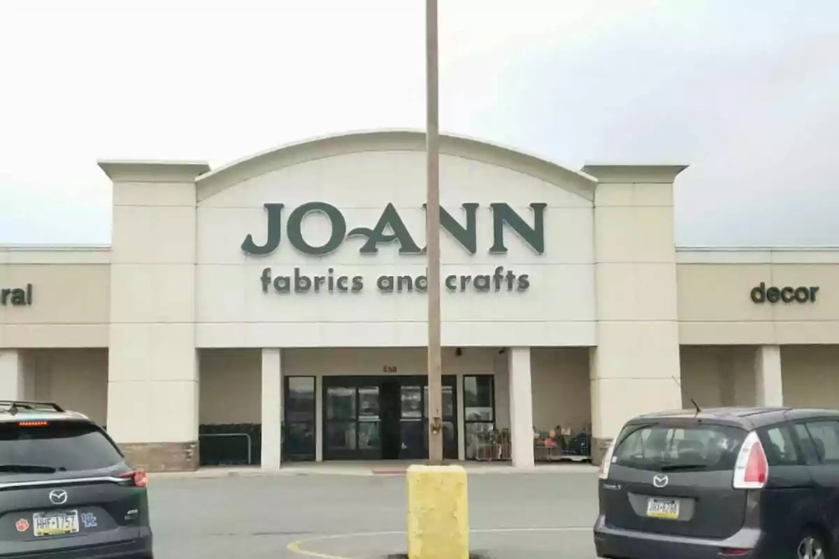 Facade of a Joann Fabrics and Crafts store with cars parked in front. Facade of a Joann Fabrics and Crafts store with cars parked in front.