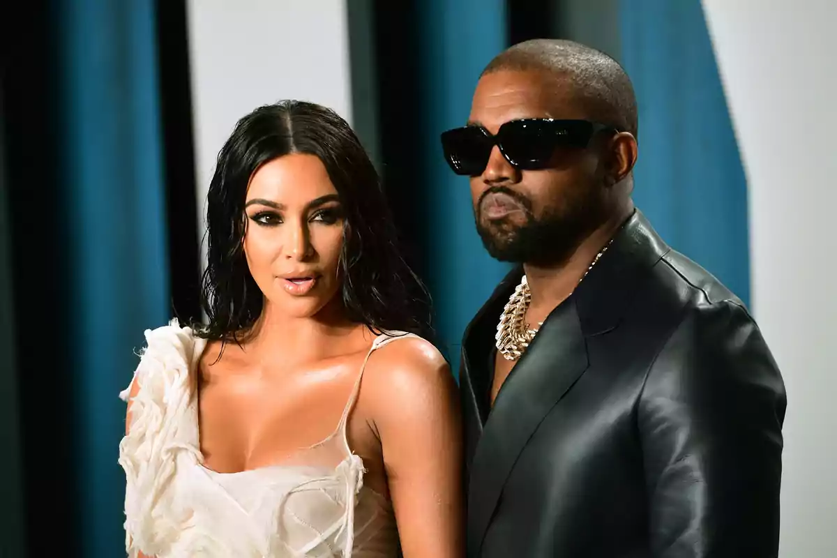 Photo of Kim Kardashian and Kanye West at a formal event, where both are dressed elegantly. Photo of Kim Kardashian and Kanye West at a formal event, where both are dressed elegantly.