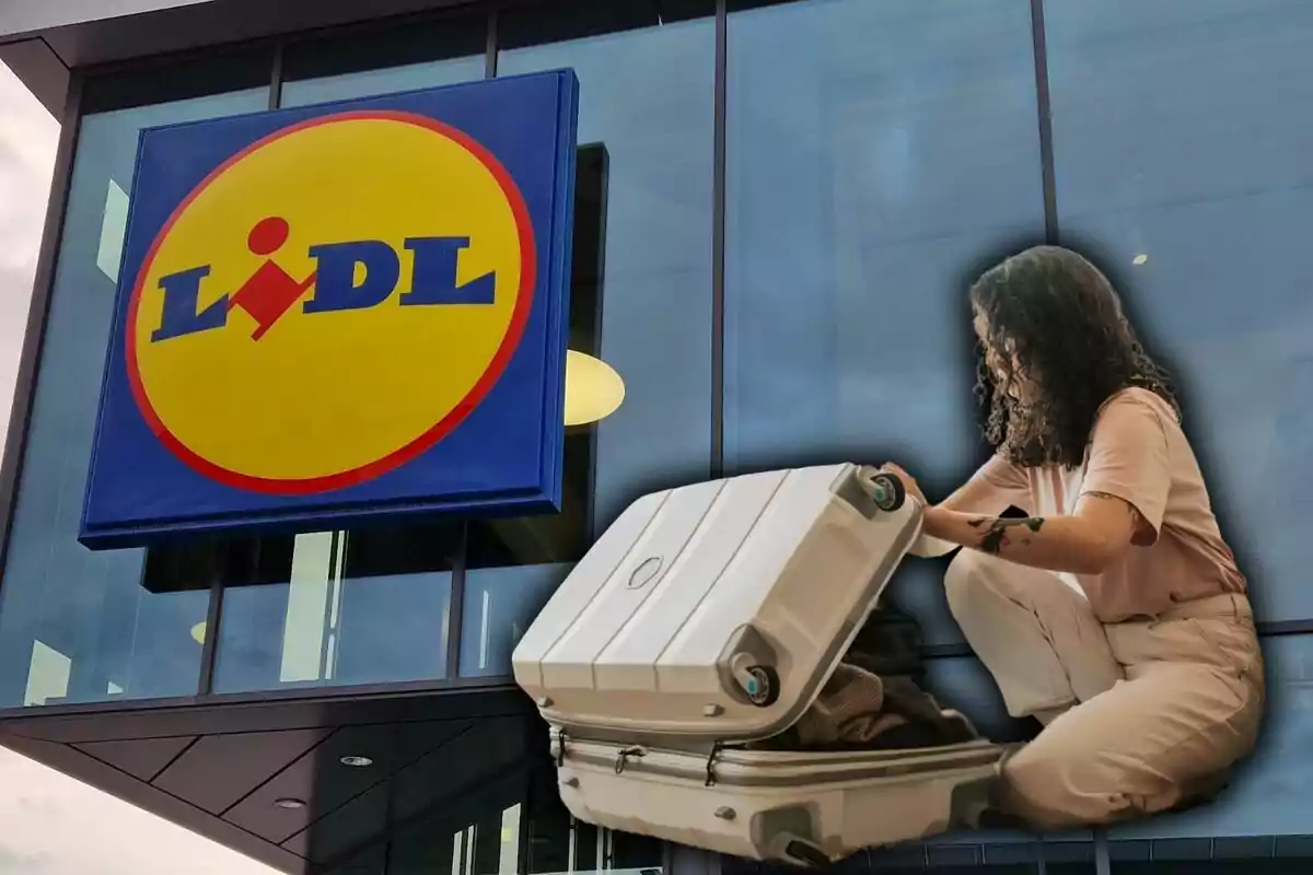 Una dona fent la maleta davant la façana d’una botiga Lidl