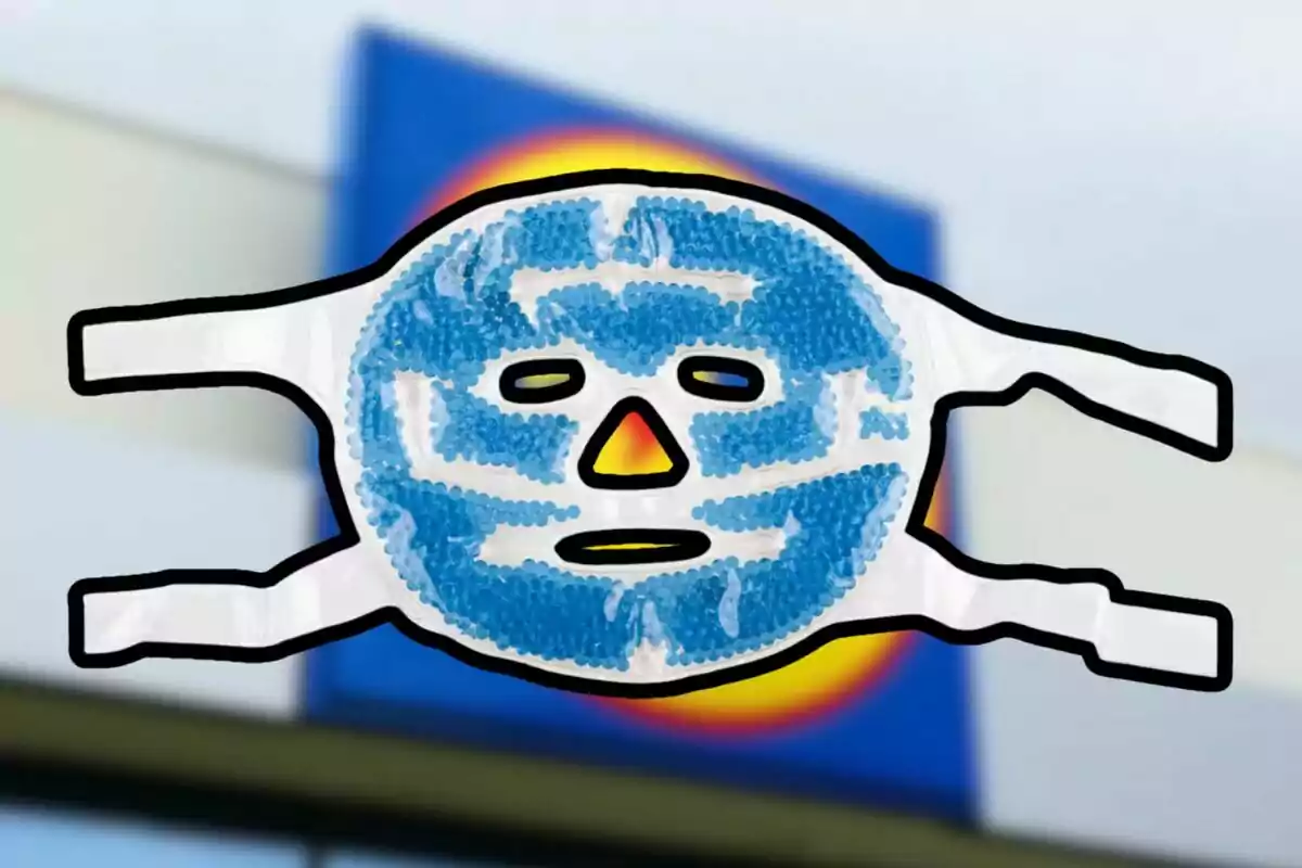 Màscara facial de gel blau amb forma de rostre humà sobre un fons desenfocat d’un rètol rectangular blau amb detalls grocs i vermells Màscara facial de gel blau amb forma de rostre humà sobre un fons desenfocat d’un rètol rectangular blau amb detalls grocs i vermells