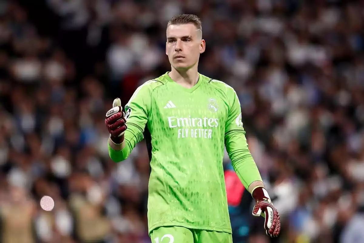 Andriy Lunin with the green Real Madrid goalkeeper shirt asking for a ball Andriy Lunin with the green Real Madrid goalkeeper shirt asking for a ball