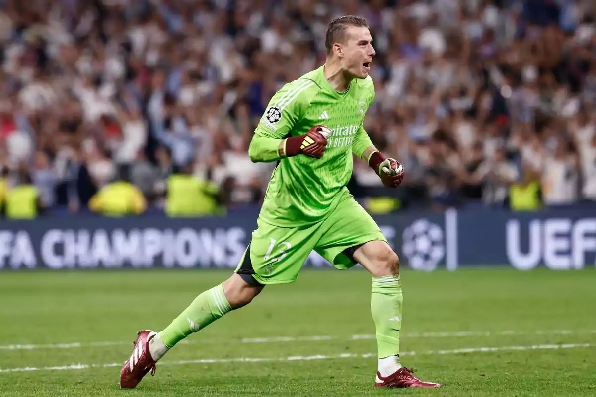 Andriy Lunin celebrates by squeezing his arm with the Real Madrid shirt Andriy Lunin celebrates by squeezing his arm with the Real Madrid shirt