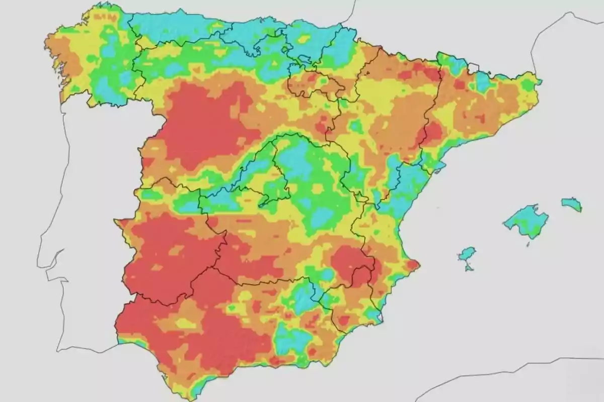 Mapa d’Espanya amb diferents zones acolorides de vermell, groc, verd i blau que representen diverses àrees climàtiques o nivells de temperatura Mapa d’Espanya amb diferents zones acolorides de vermell, groc, verd i blau que representen diverses àrees climàtiques o nivells de temperatura