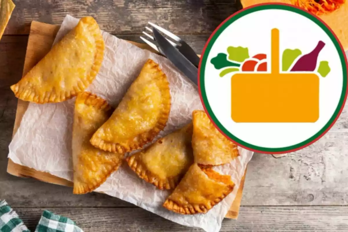 Golden empanadas on wax paper with a food basket logo in the top right corner. Golden empanadas on wax paper with a food basket logo in the top right corner.