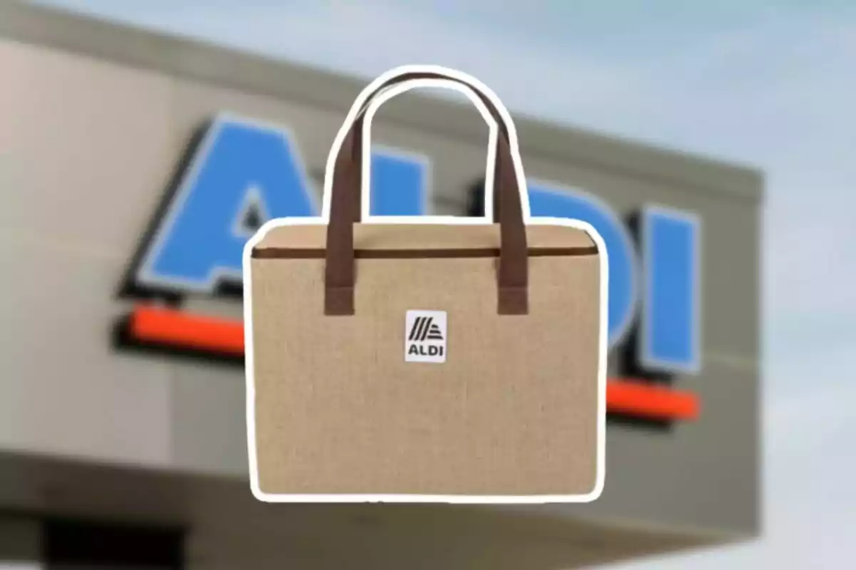 A fabric bag with brown handles and a logo in the center, in front of a blurry store sign. A fabric bag with brown handles and a logo in the center, in front of a blurry store sign.
