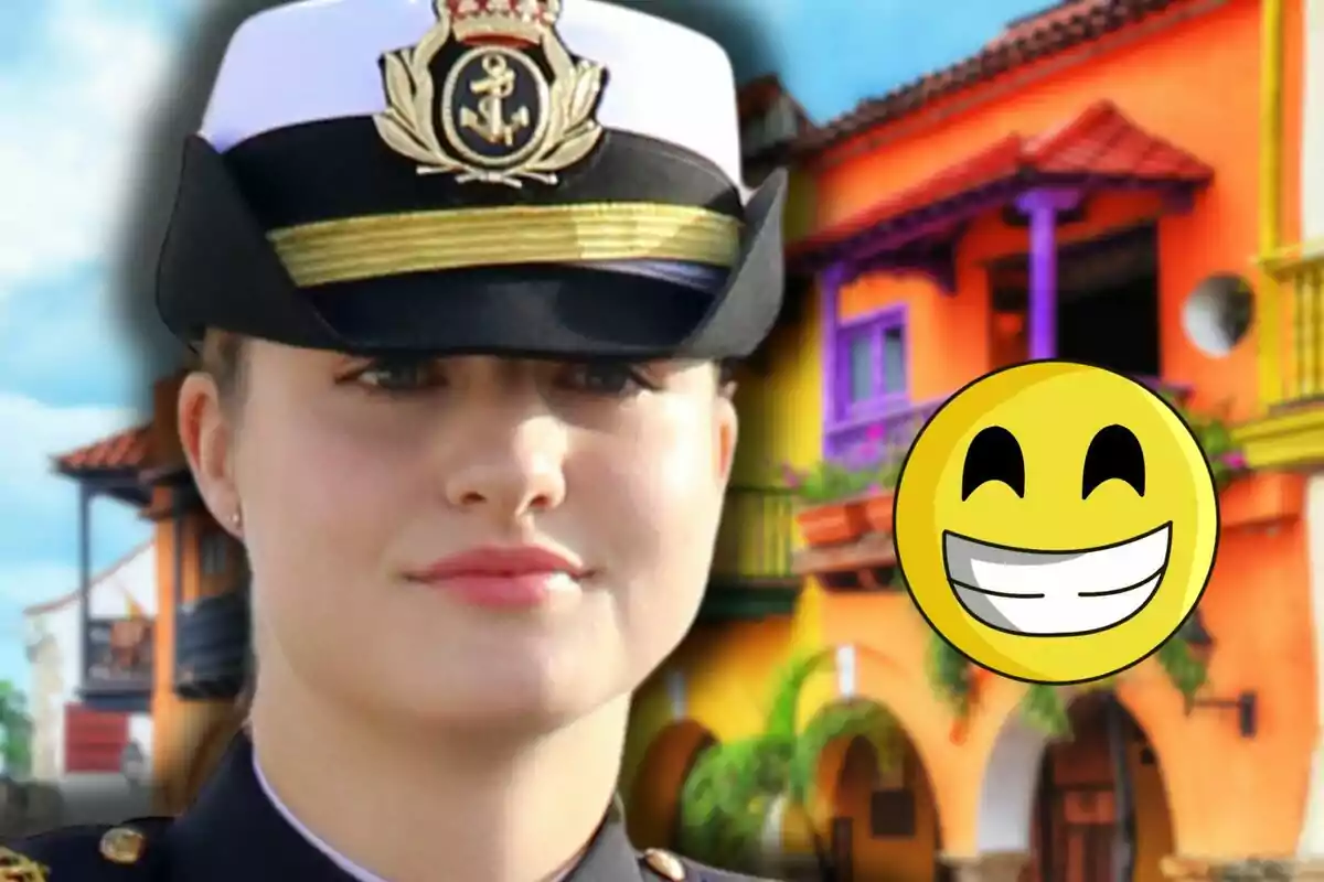 La princesa Leonor amb uniforme militar i gorra està davant d'un edifici acolorit amb un emoji somrient superposat.