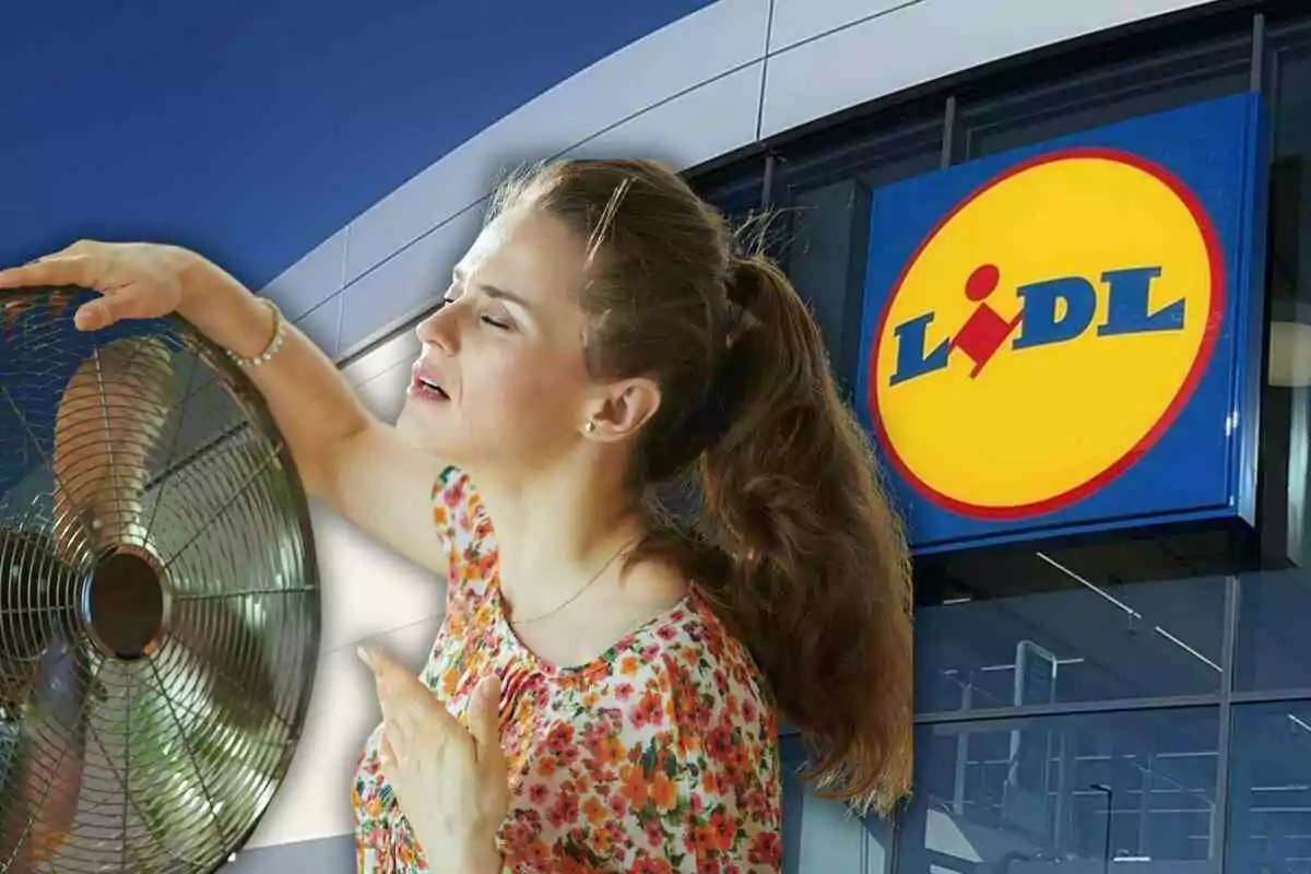 Dona gaudint de l’aire d’un ventilador davant d’una botiga Lidl