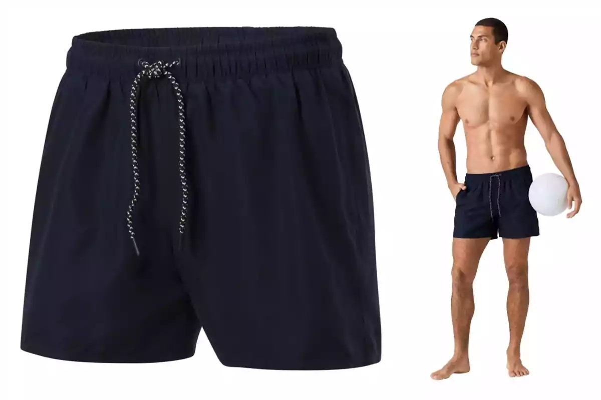 Un home amb banyador negre de Lidl sosté una pilota blanca, amb un enfocament en el disseny del pantaló curt que té un cordó ajustable. Un home amb banyador negre de Lidl sosté una pilota blanca, amb un enfocament en el disseny del pantaló curt que té un cordó ajustable.