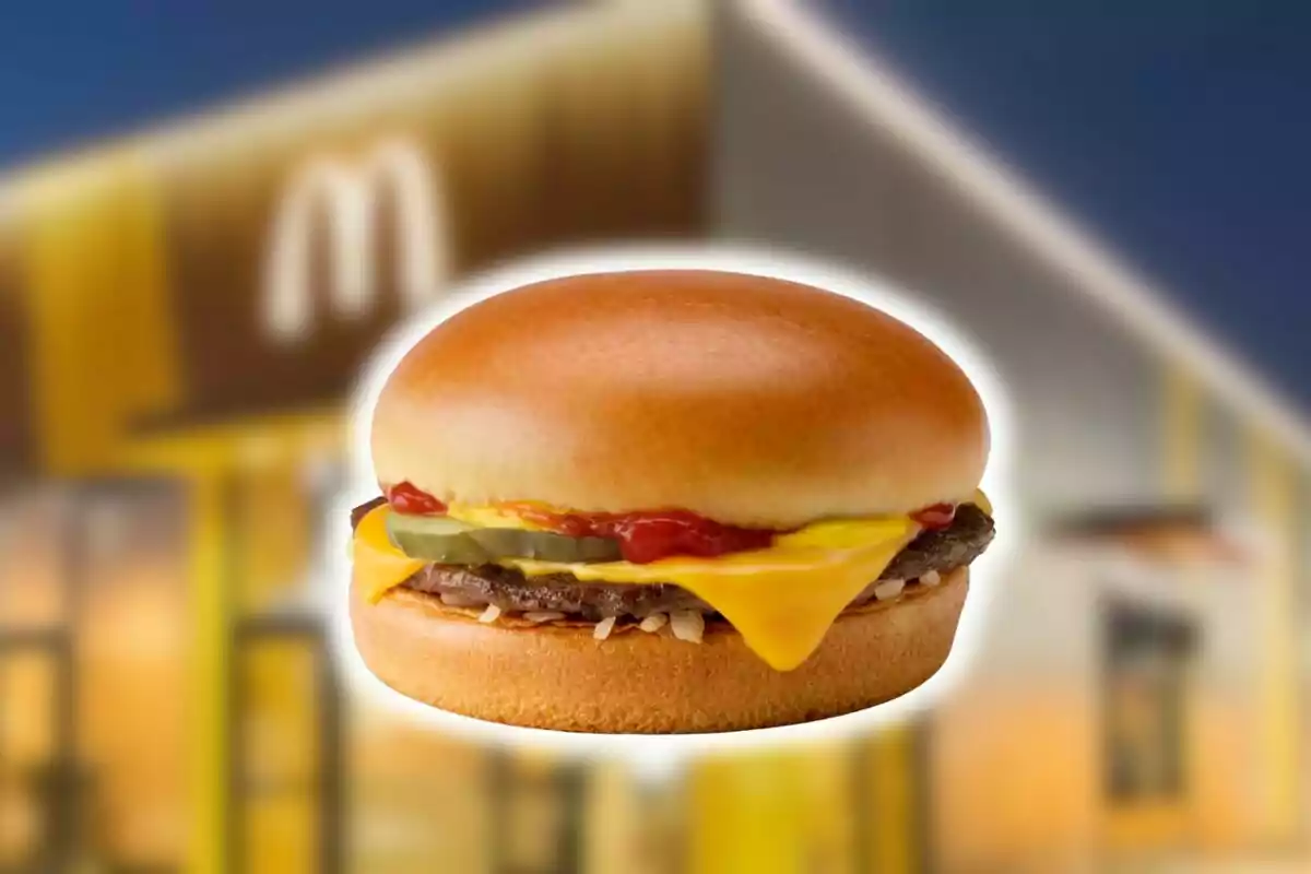 A cheeseburger with pickles, onions, mustard, and ketchup from McDonald's against a blurred background of a fast-food restaurant. A cheeseburger with pickles, onions, mustard, and ketchup from McDonald's against a blurred background of a fast-food restaurant.