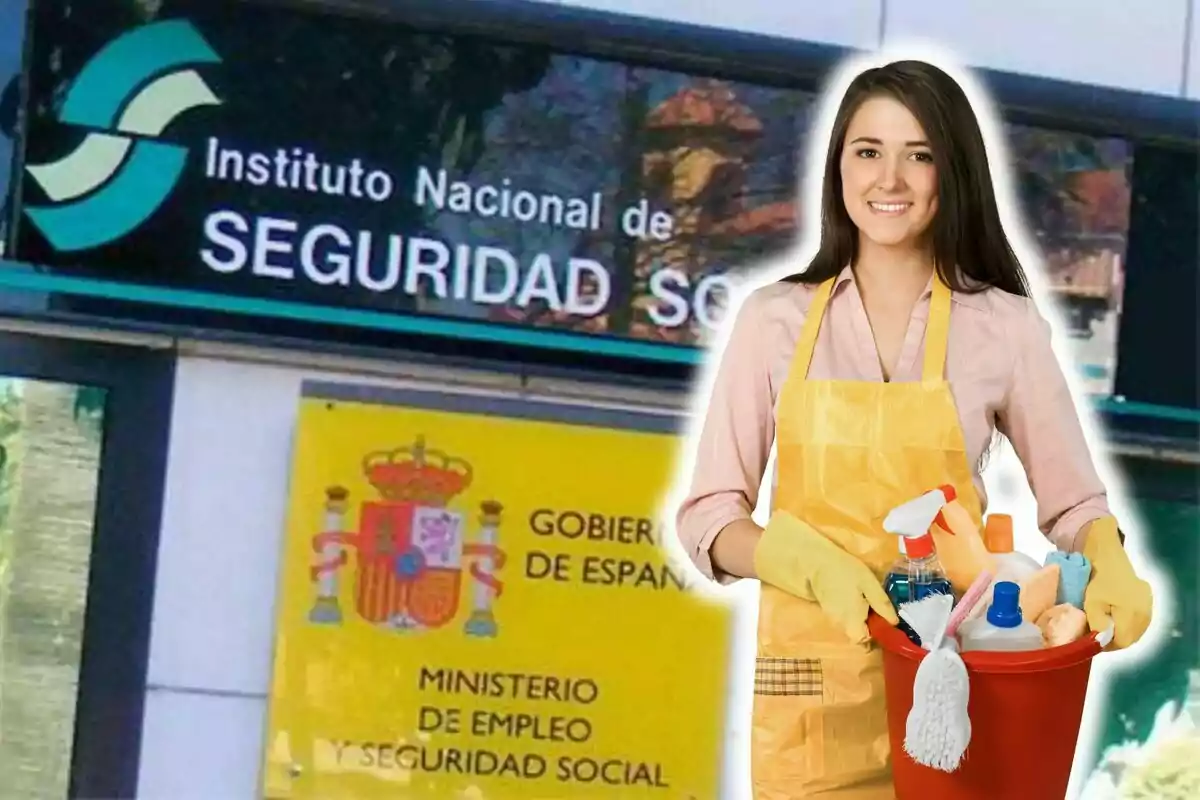 Una dona amb davantal i guants de neteja sosté una galleda amb productes de neteja davant d'un edifici de l'Institut Nacional de Seguretat Social a Espanya.