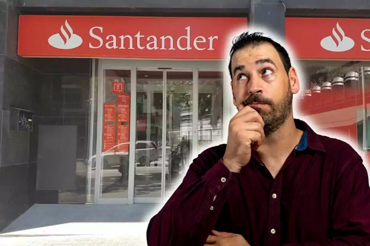 Un home pensatiu davant d'una sucursal del banc Santander.