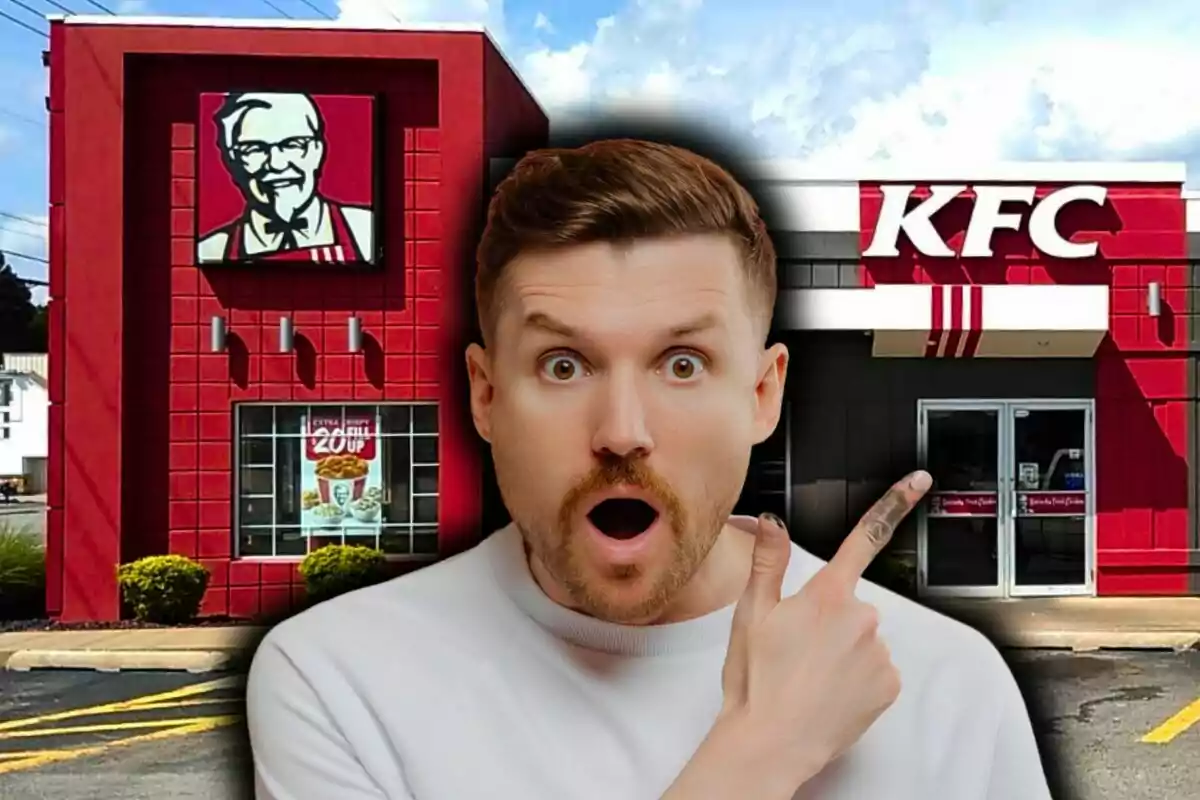A man with a surprised expression points to a fast-food restaurant in the United States, which is KFC.