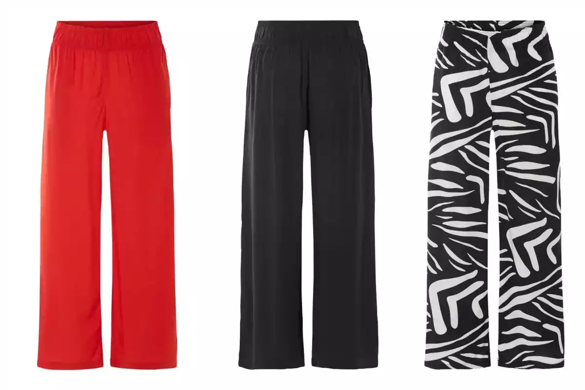 Tres pantalons de dona de cama ampla de Lidl en diferents estils: un de vermell, un de negre i un amb estampat blanc i negre. Tres pantalons de dona de cama ampla de Lidl en diferents estils: un de vermell, un de negre i un amb estampat blanc i negre.