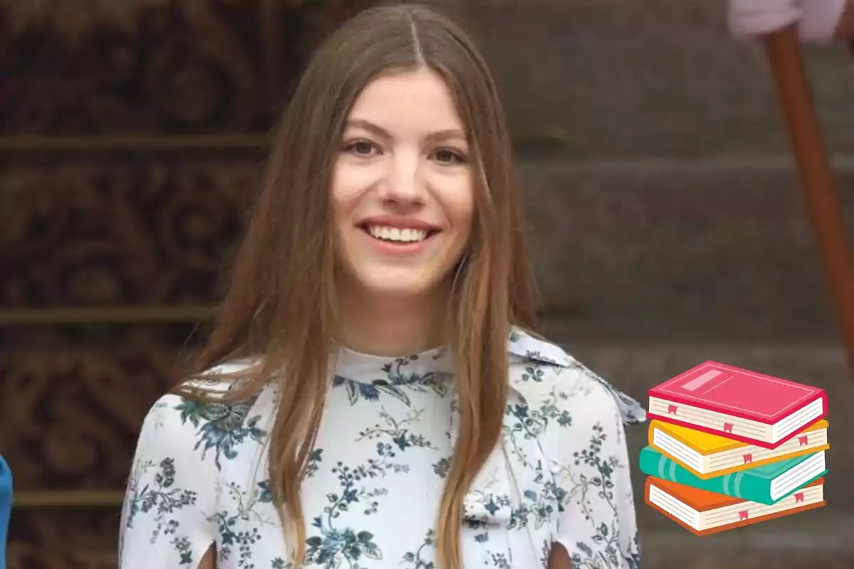 Una jove somrient amb cabell llarg i laci, vestida amb una brusa de flors, amb una icona de llibres apilats a la cantonada inferior dreta. Una jove somrient amb cabell llarg i laci, vestida amb una brusa de flors, amb una icona de llibres apilats a la cantonada inferior dreta.