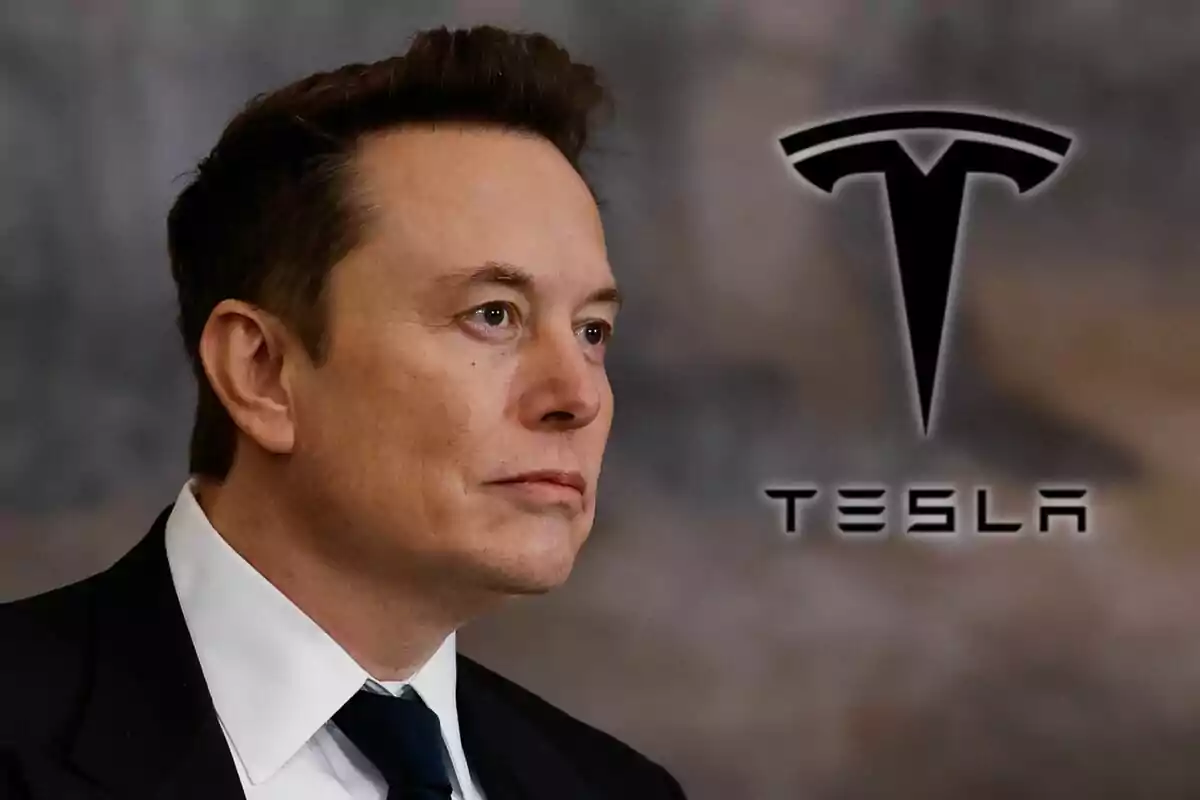 A man in profile wearing a suit and tie appears next to the Tesla logo on a blurred background.