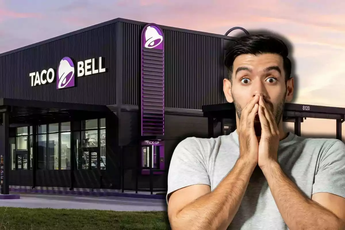 A man surprised in front of a Taco Bell restaurant at sunset.