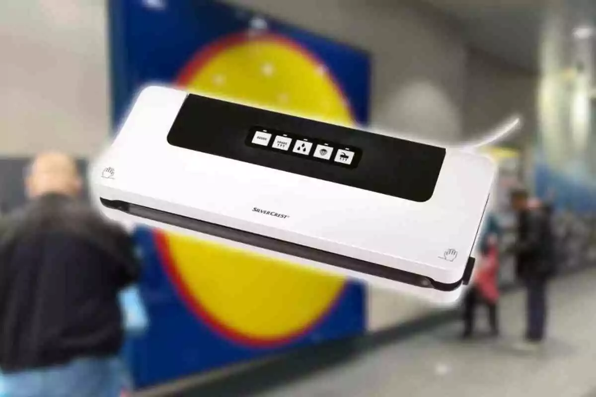 A SilverCrest brand vacuum sealing machine with buttons on the top, against a blurred background of a public space. A SilverCrest brand vacuum sealing machine with buttons on the top, against a blurred background of a public space.