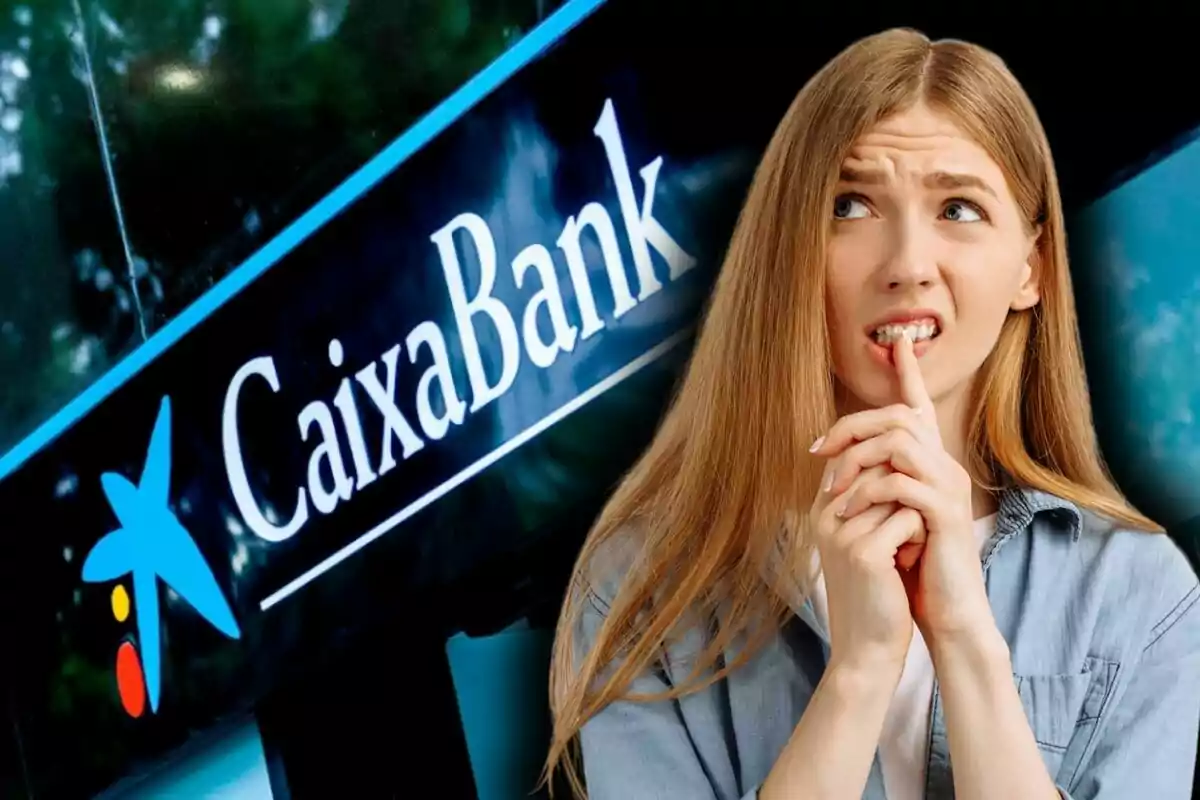 Dona pensativa davant d'un cartell de CaixaBank.