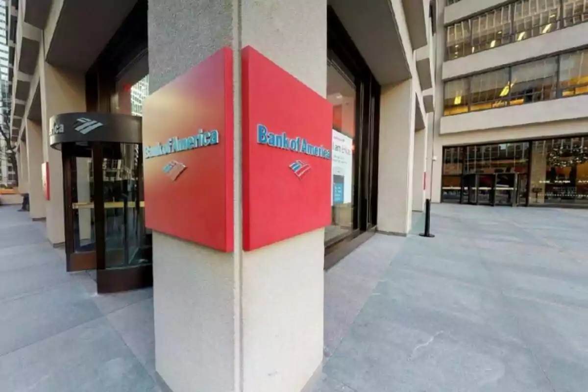 Entrance of a bank branch with red and blue signs in a modern building. Entrance of a bank branch with red and blue signs in a modern building.