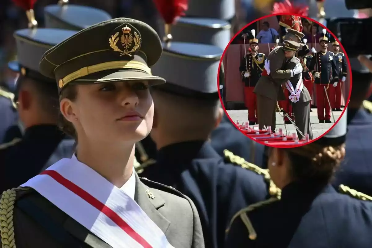 Leonor cadet amb uniforme militar i una banda blanca amb una franja vermella, al fons s'observa la seva abraçada amb Felip VI.