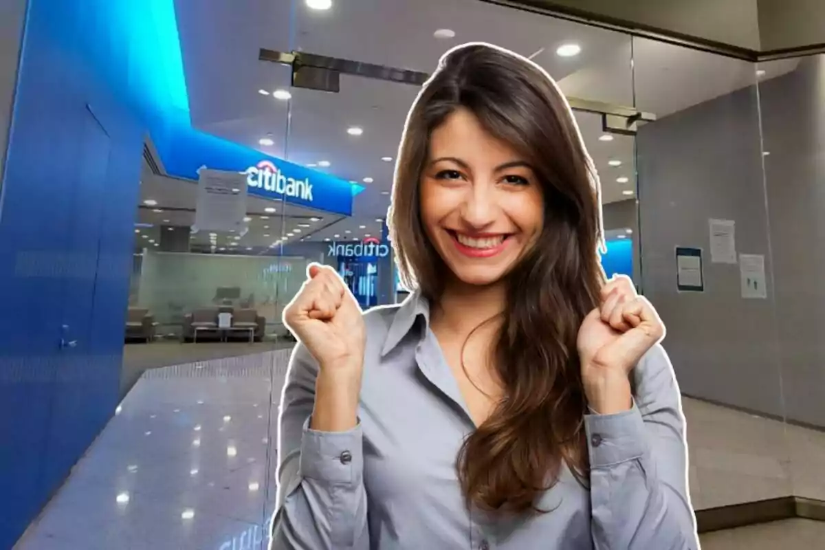 Smiling woman in a gray jersey in front of a bank entrance. Smiling woman in a gray jersey in front of a bank entrance.