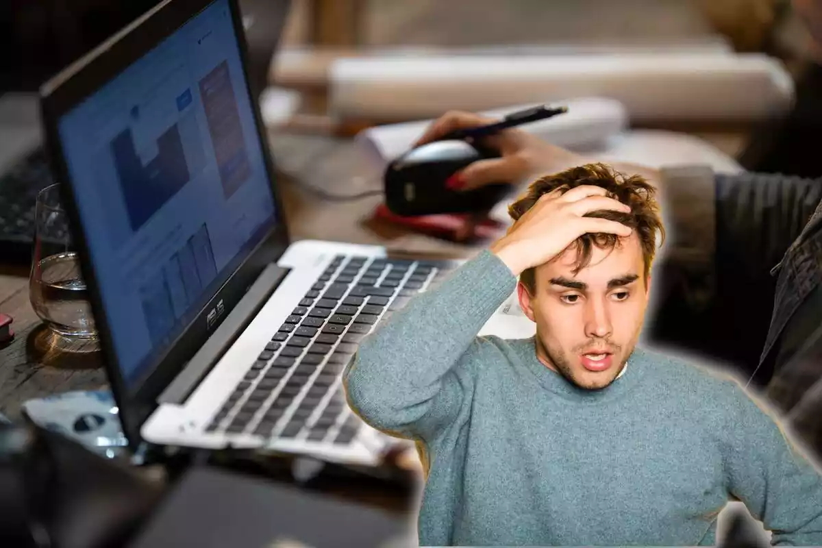 A person is operating a computer in the background, and in the foreground is a man with a worried face raising his hand to his head