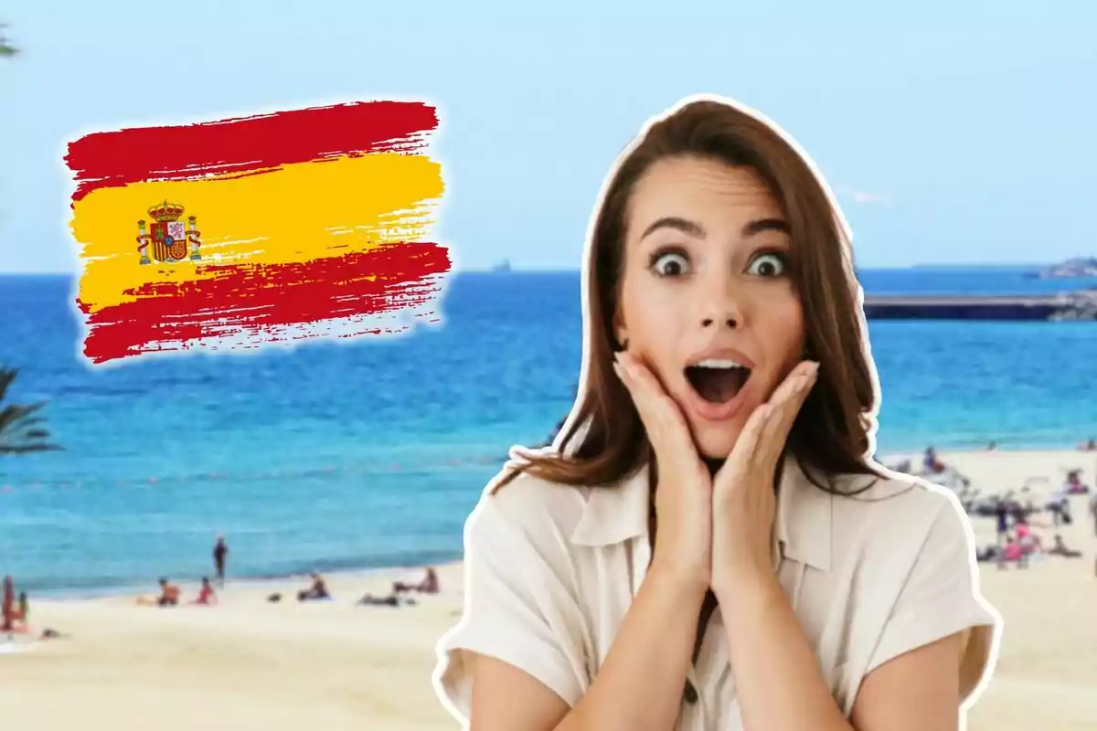 Woman surprised on the beach with a Spanish flag in the background.