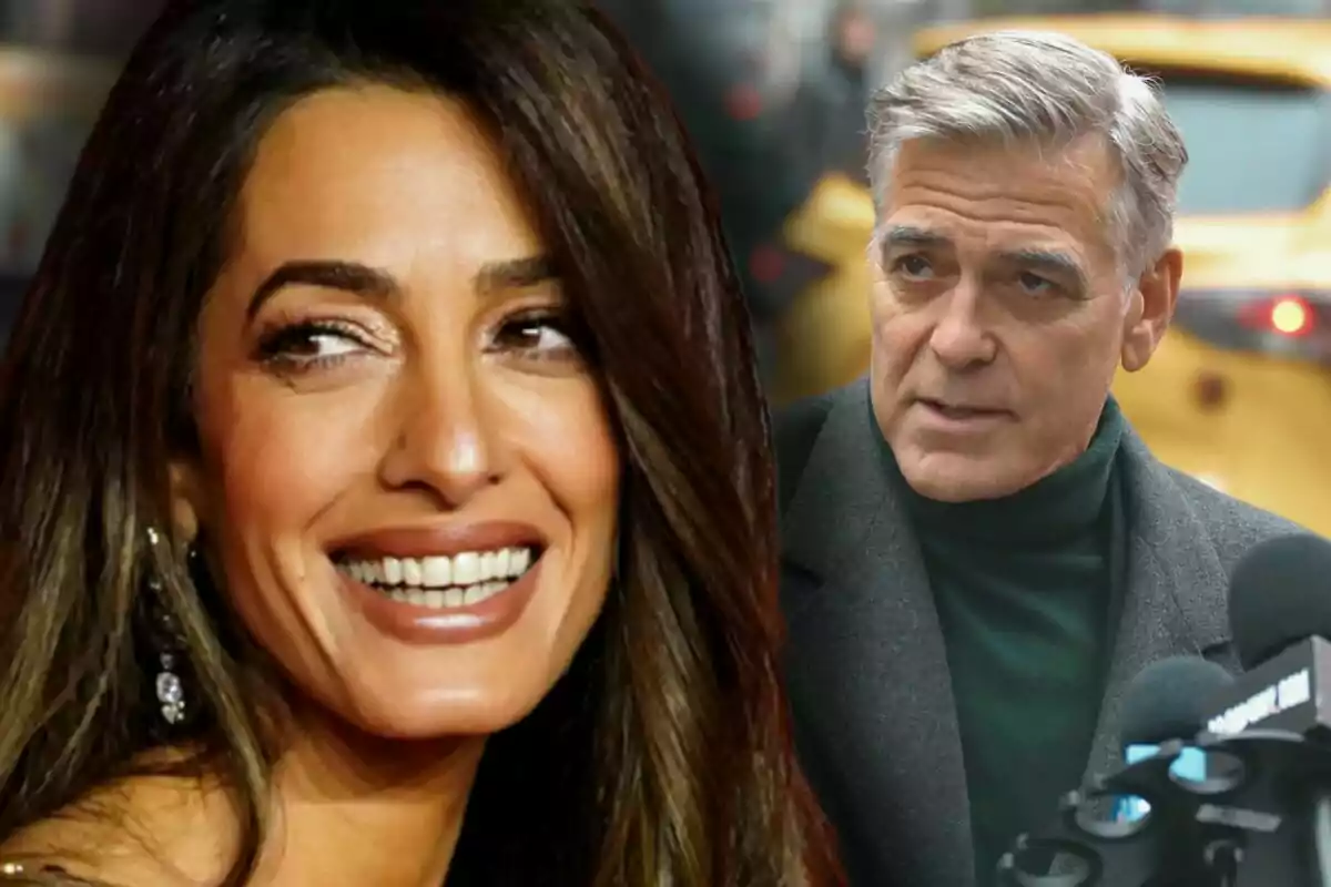 Amal Clooney smiling in the foreground and George Clooney speaking in front of microphones in an urban setting.