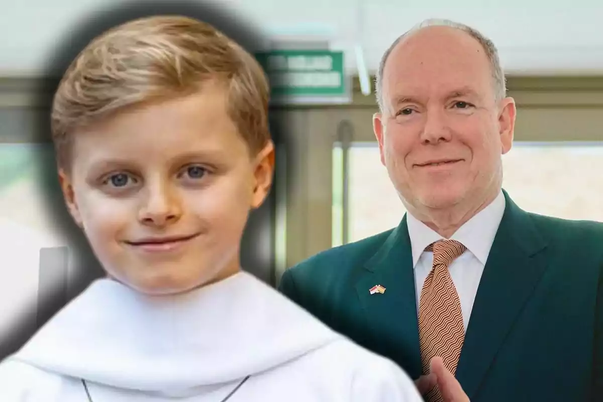 Jacques of Monaco in a white robe and Albert of Monaco in a suit and tie pose together indoors.