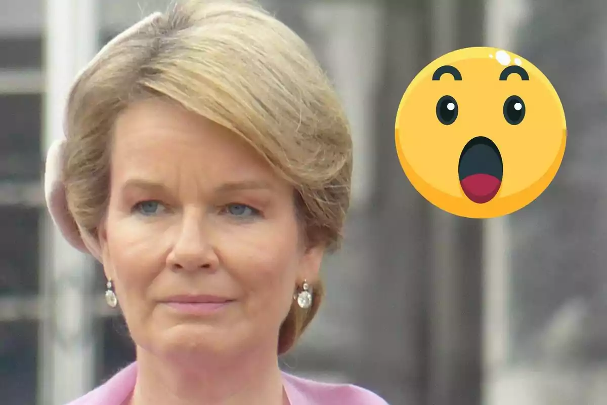 Mathilde of Belgium with a serious expression and a surprised emoji next to her