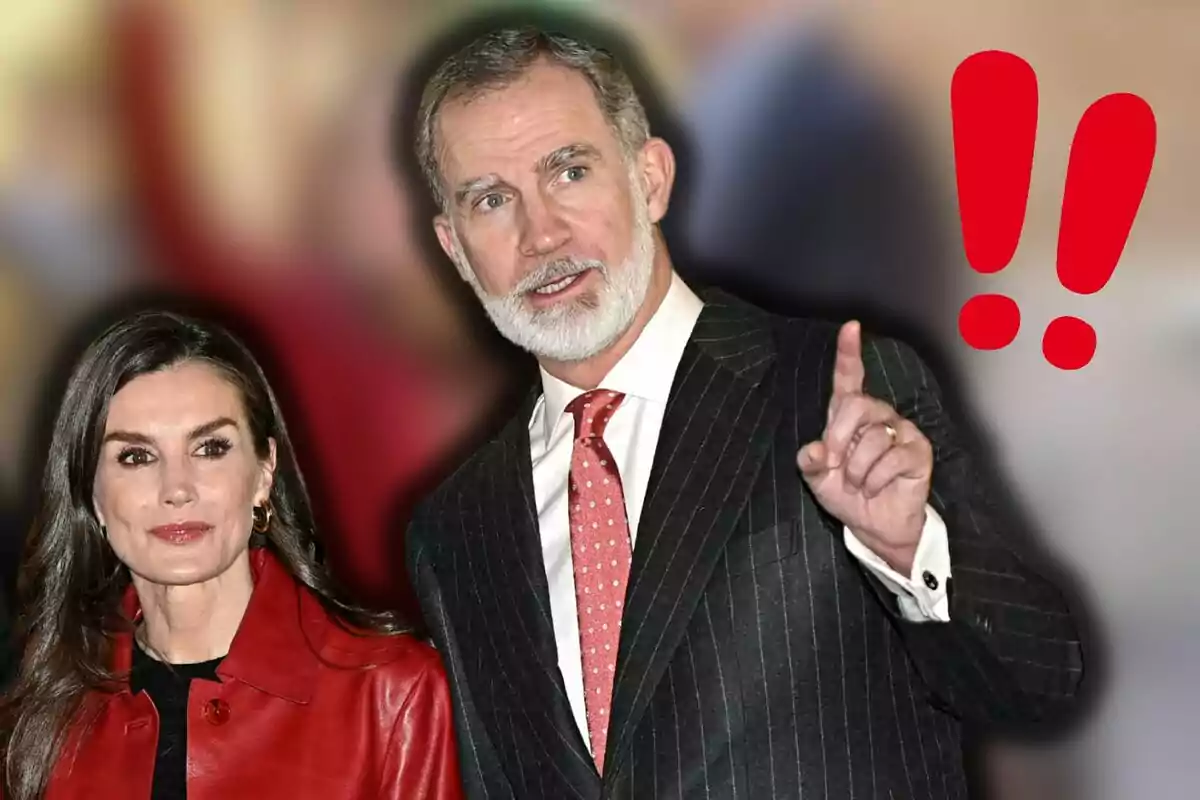 La reina Letícia i Felip VI vestits formalment, amb un fons desenfocat i dos signes d'exclamació vermells a la dreta.