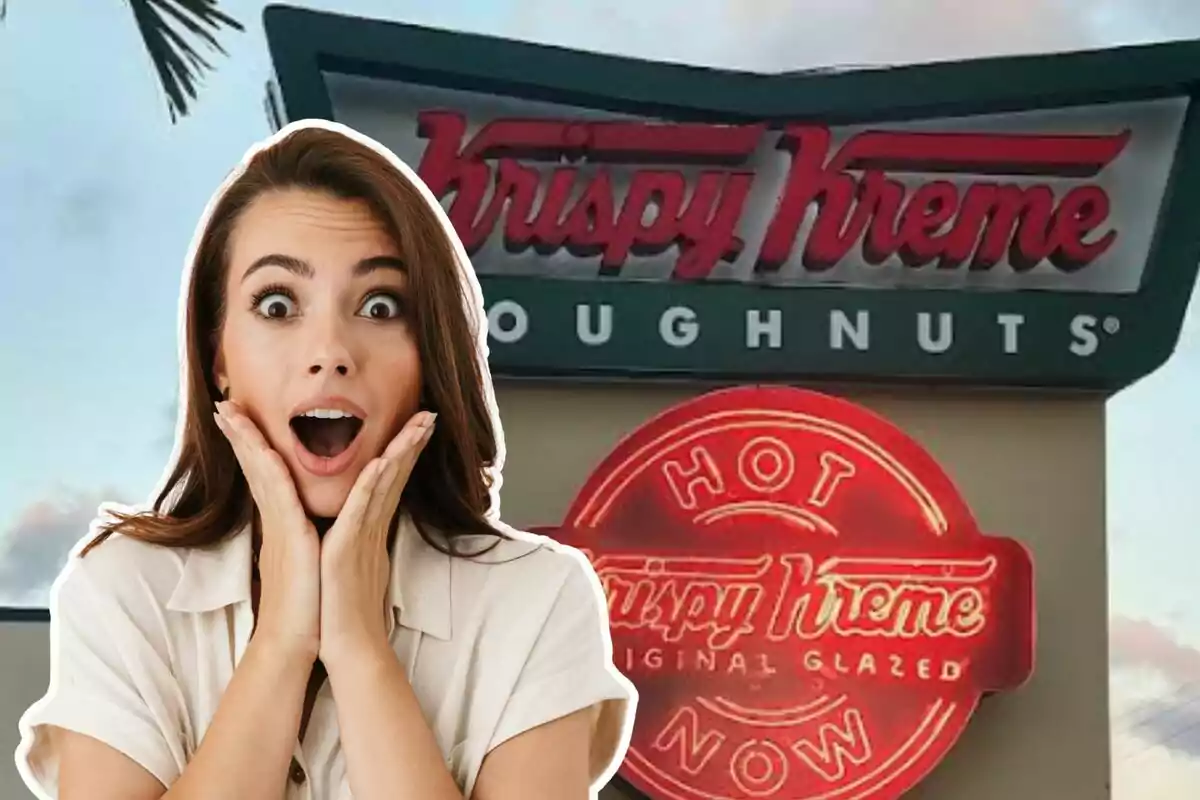 A woman with a surprised expression is in front of a lit Krispy Kreme sign.