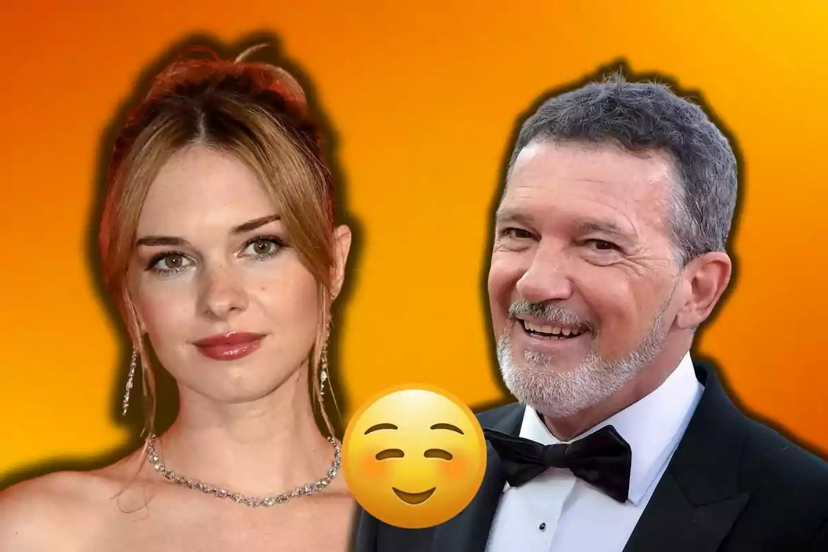 Stella del Carmen i Antonio Banderas posant junts amb un fons taronja i un emoji somrient al centre.