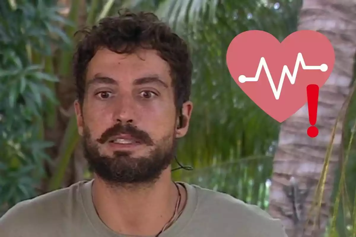 Joshua Velázquez amb expressió de sorpresa o preocupació en un entorn tropical amb un gràfic de cor i un signe d'exclamació superposat.
