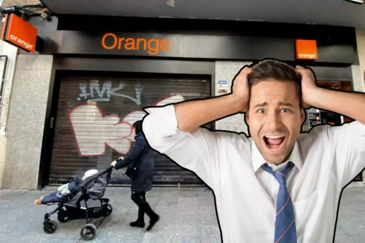 L'aparador d'una botiga Orange, i un home emportant-se les mans al cap
