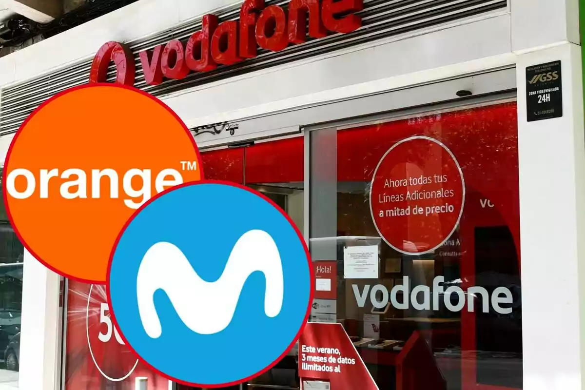 Logotips d'Orange i Movistar superposats sobre la façana d'una botiga de Vodafone.