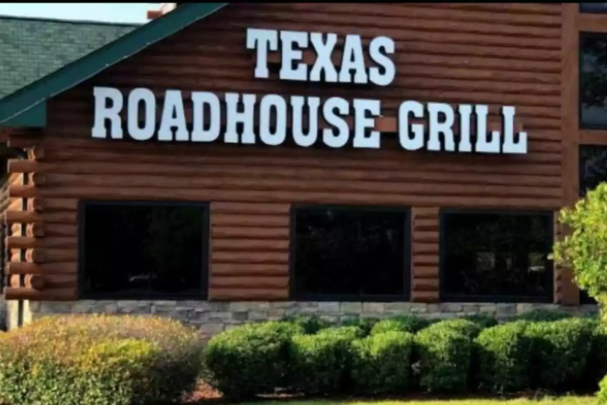 Facade of a restaurant with a large sign that says Facade of a restaurant with a large sign that says