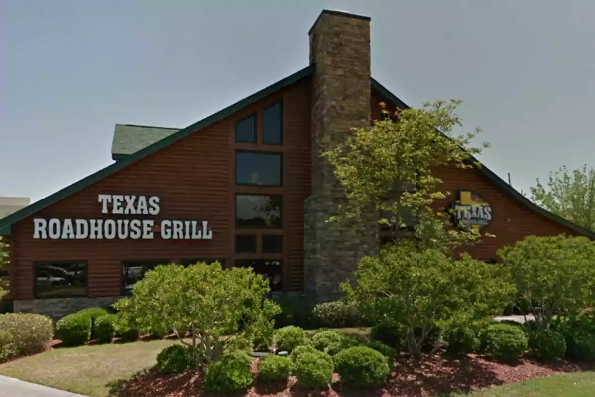 Restaurant building with a sign that says Restaurant building with a sign that says
