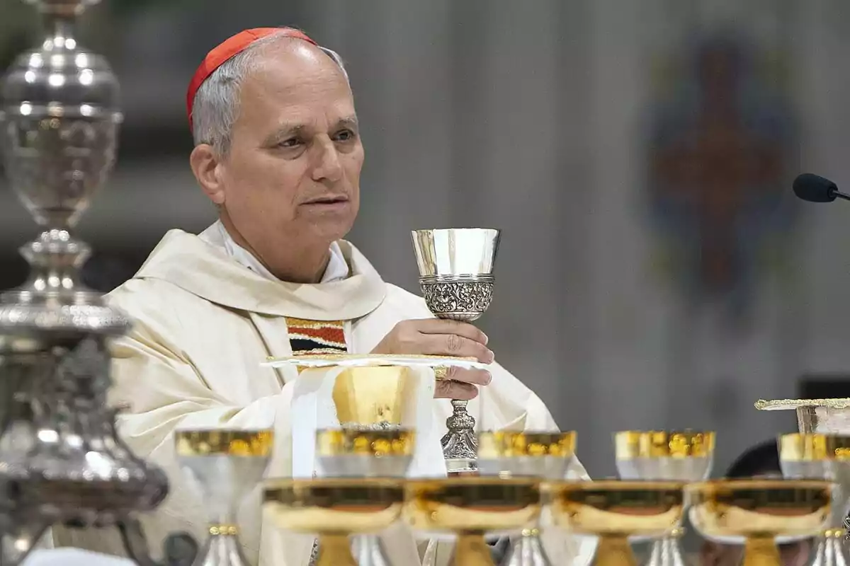 A cleric holding a chalice during a religious ceremony. A cleric holding a chalice during a religious ceremony.