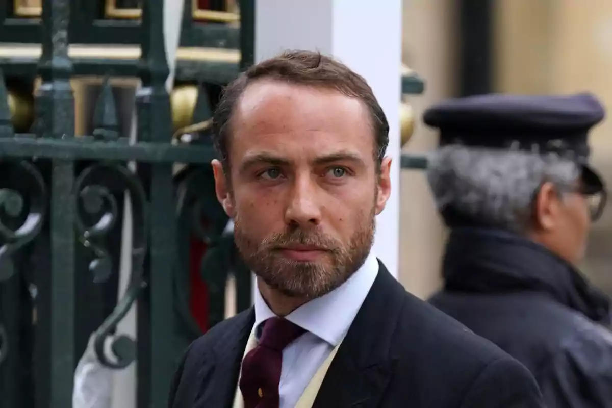 James Middleton in a formal suit and tie in an urban setting James Middleton in a formal suit and tie in an urban setting