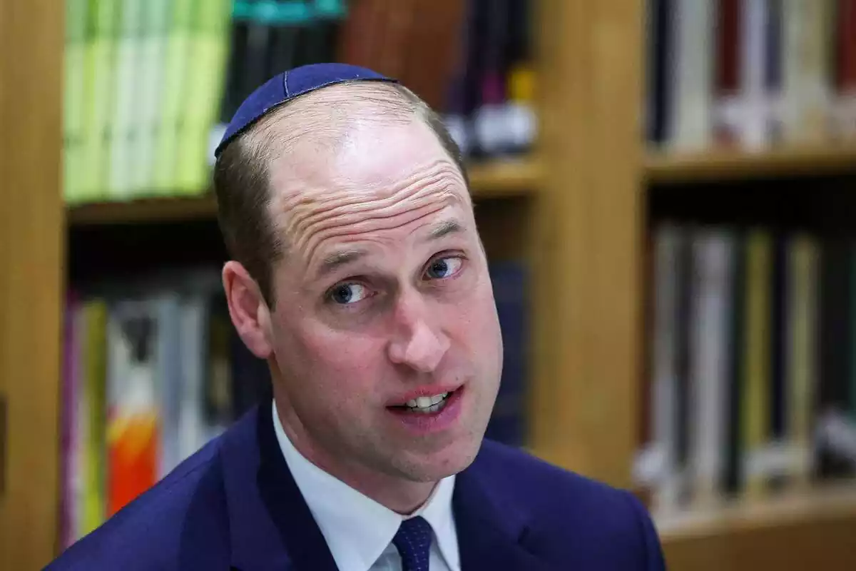 Prince William speaking looking to the side in a blue suit Prince William speaking looking to the side in a blue suit