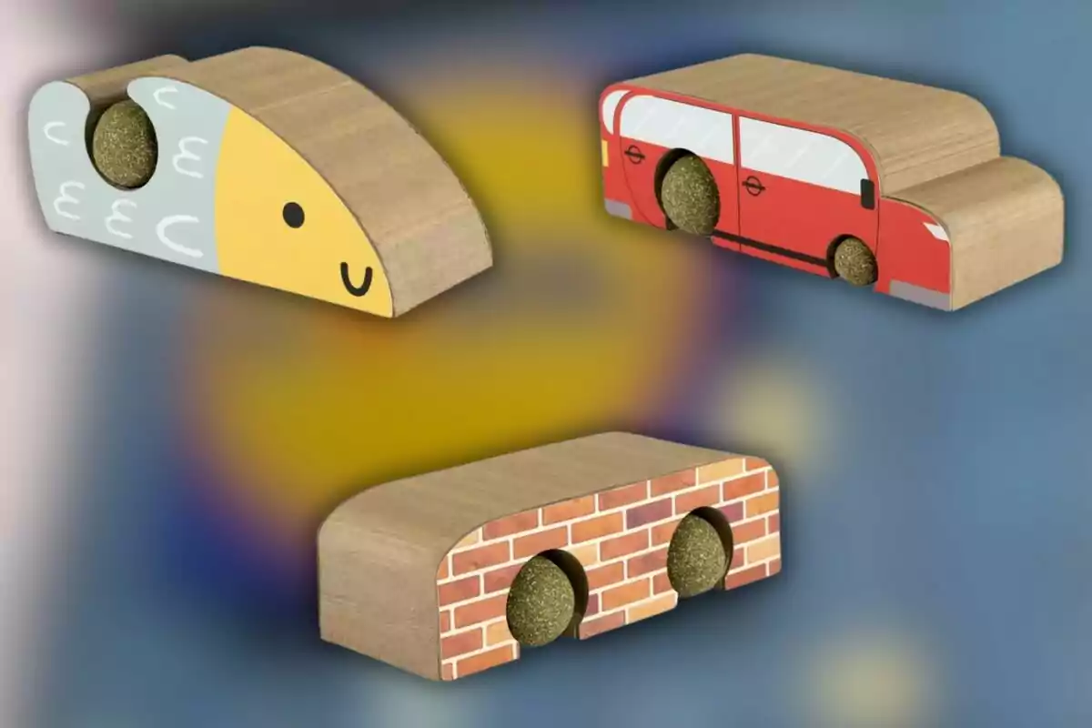 Tres blocs de fusta amb formes i dissenys diferents: un amb aparença de peix, un altre d'autobús vermell i l'últim amb disseny de maons, cadascun amb una bola verda incrustada. Tres blocs de fusta amb formes i dissenys diferents: un amb aparença de peix, un altre d'autobús vermell i l'últim amb disseny de maons, cadascun amb una bola verda incrustada.