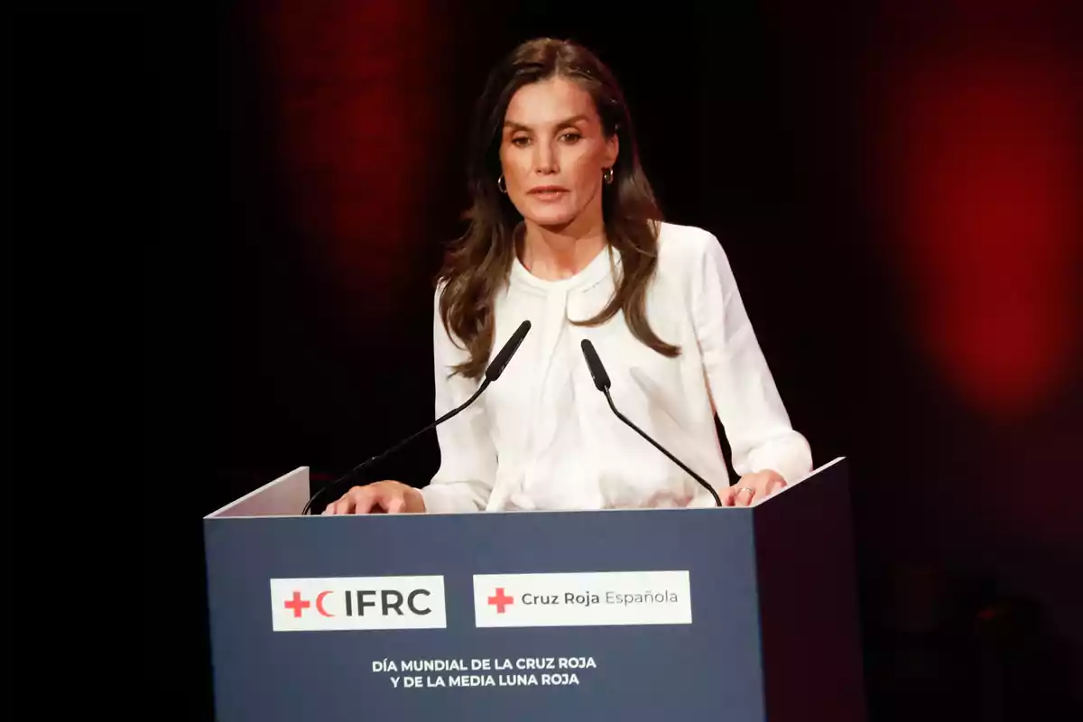 Queen Letizia speaking at a podium during a Spanish Red Cross event. Queen Letizia speaking at a podium during a Spanish Red Cross event.