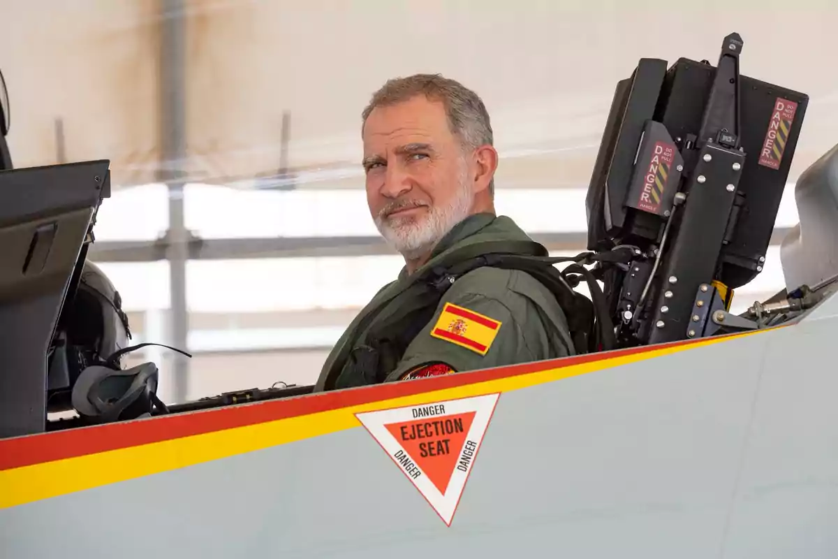 Felipe VI in military uniform with a Spanish flag patch sitting in the cockpit of a fighter jet Felipe VI in military uniform with a Spanish flag patch sitting in the cockpit of a fighter jet