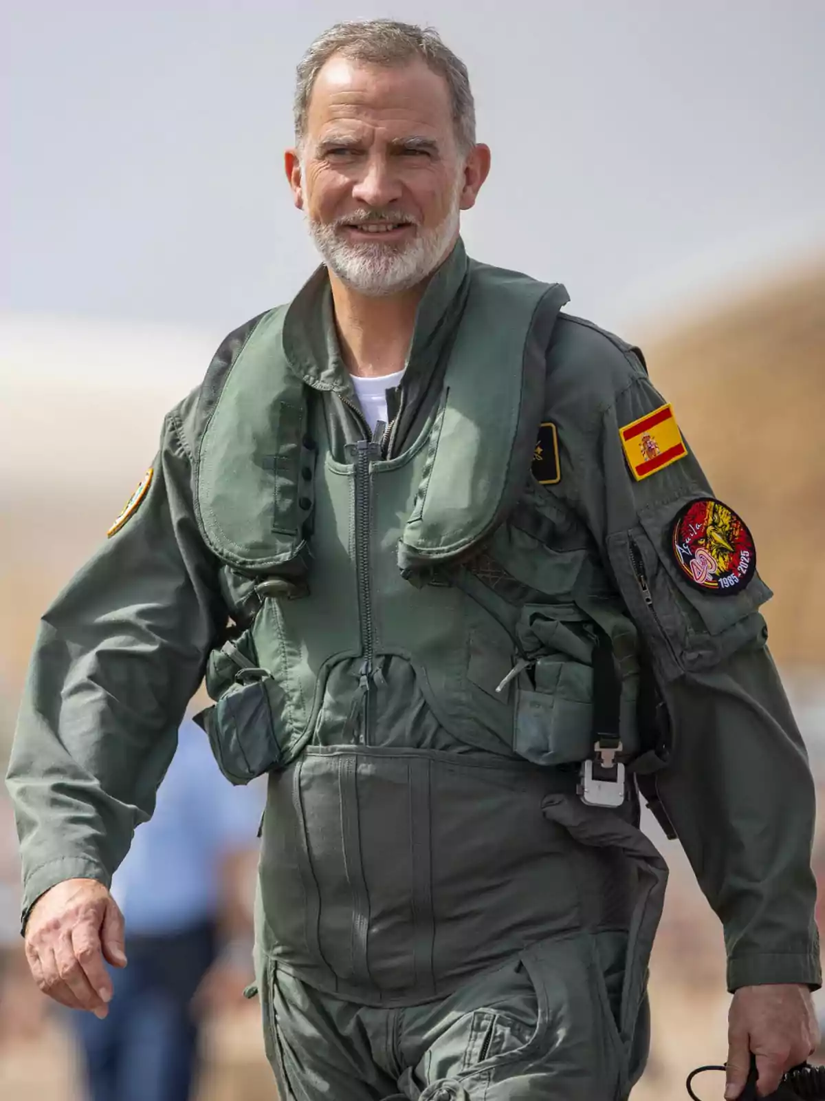 Felipe VI wearing a green military pilot uniform with Spanish patches and an insignia on the sleeve Felipe VI wearing a green military pilot uniform with Spanish patches and an insignia on the sleeve