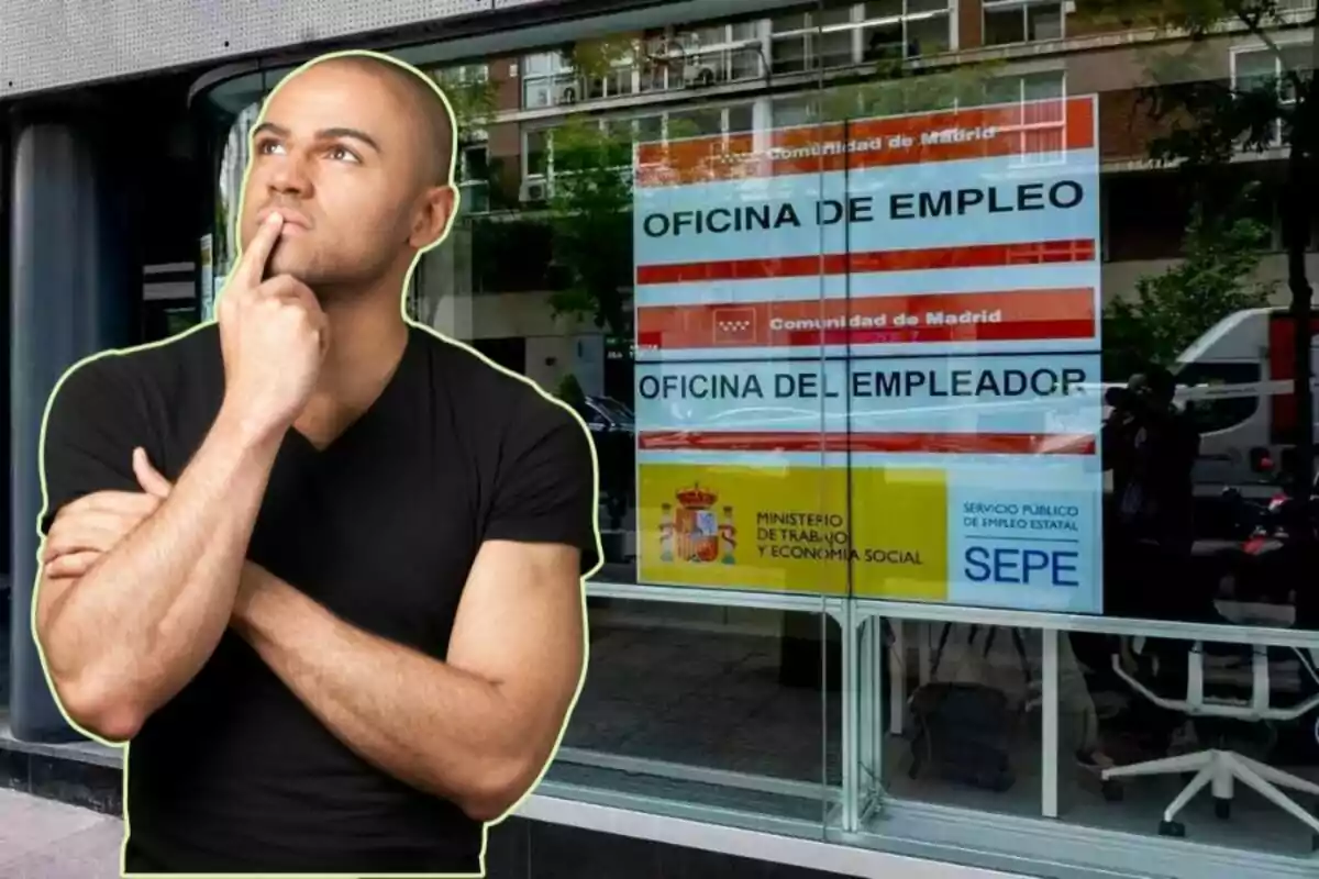 Un home pensatiu davant d?una oficina d?ocupació a Madrid.