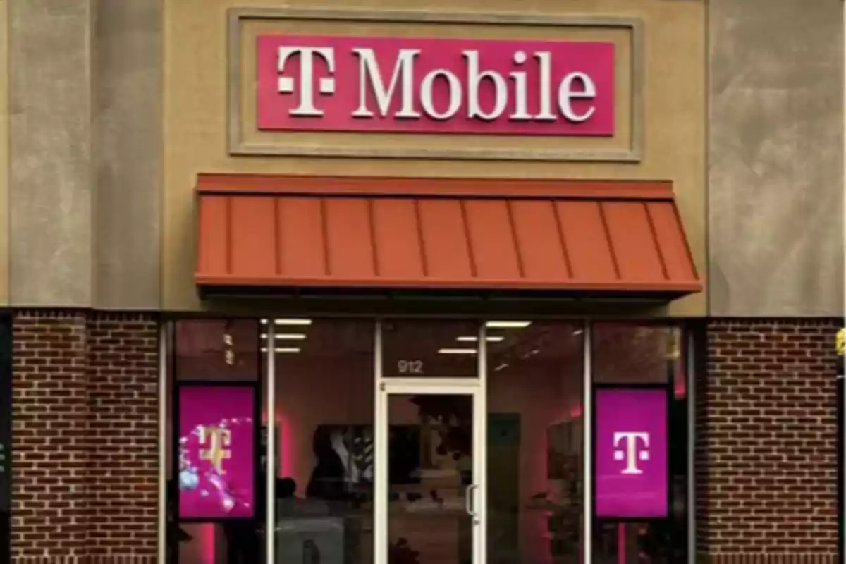 T-Mobile store facade with a pink sign and glass windows. T-Mobile store facade with a pink sign and glass windows.